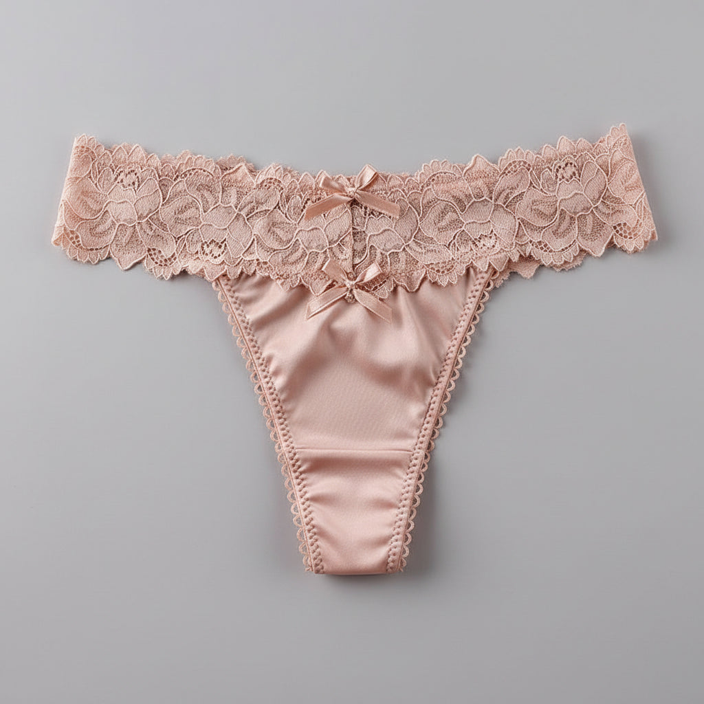 Pink lace thong on a gray fur surface
